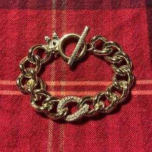 Victoria’s Secret bracelet.